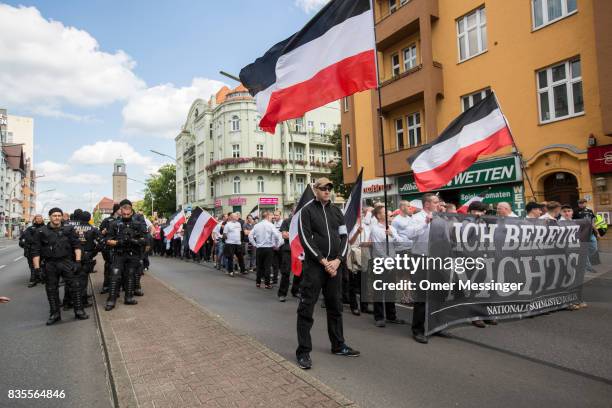 German police stand in formation as Some 1000 participants affiliated with Neo-Nazi and extreme right groups marched through the street of Berlin's...