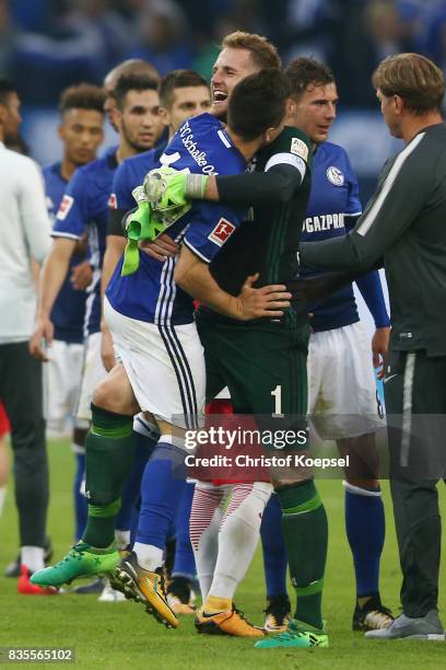 Ralf Faehrmann of Schalke celebrates with Yevhen Konoplyanka of Schalke following their victory during the Bundesliga match between FC Schalke 04 and...