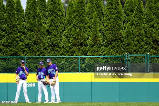 Lorenzo Giuseppe Bacci, Mattio Giovanelli, and Nicola Spagnolo of the Europe-Africa team from Italy stand in the outfield during Game 9 of the 2017...
