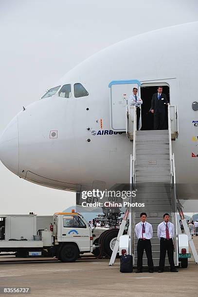 Staffs stand guard in front of an Airbus A380 at the 7th China International Aviation and Aerospace Exhibition on November 4, 2008 in Zhuhai of...