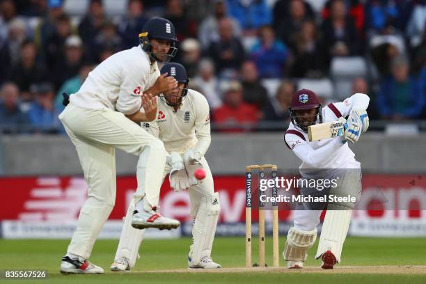 Jermaine Blackwood of West Indies drives off the bowling of Moeen Ali as Mark Stoneman turns his back during day three of the 1st Investec Test match...