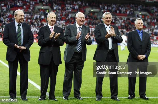 Jimmy Armfield, Gerry Byrne, Ron Flowers, Norman Hunter and Terry Paine on the pitch at half time to collect their 1966 World Cup winners medals.