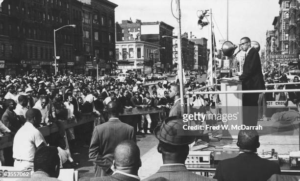 American Civil Rights and religious leader Malcolm X speaks to a crowd at a rally in Harlem , New York, New York, September 7, 1963.