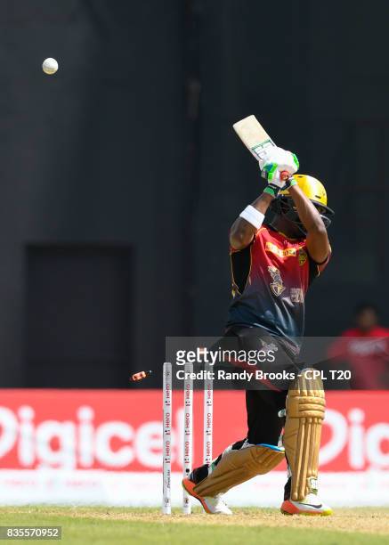 In this handout image provided by CPL T20, Darren Bravo of Trinbago Knight Riders bowled by Rayad Emrit of Guyana Amazon Warriors during Match 17 of...