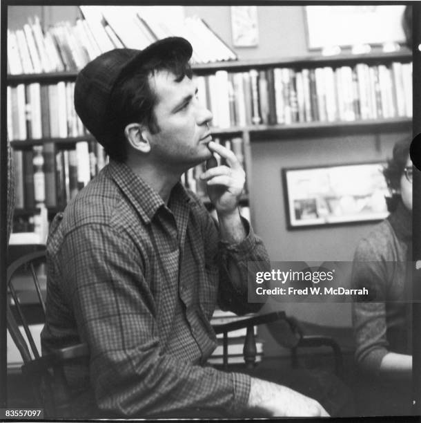 American author and poet Jack Kerouac contemplates a poem at the apartment of photographer McDarrah and his soon-to-be wife, Gloria , New York, New...