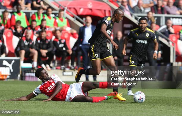 Wimbledon's Nadjim Abdou is tackled by Fleetwood Town's Jordy Hiwula during the Sky Bet League One match between Fleetwood Town and A.F.C. Wimbledon...
