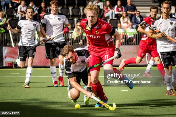 Amaury Keusters of the Belgian mens hockeyteam vies with Fabian Zeidler of Austria during the European Hockey Championship match between Belgium and...