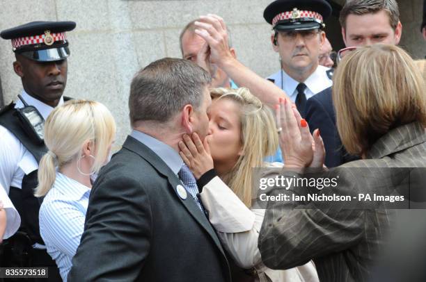 George Kinsella is kissed by daughter Jade as they leaves the Old Bailey in London, after three men were found guilty of the murder of his son, Ben...