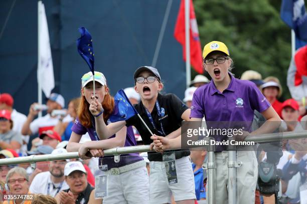Young Scottish golfers from 'Project 19' Carmen Griffiths, Eilidh Henderson, and Hannah Darling cheer on the European Team during the morning...
