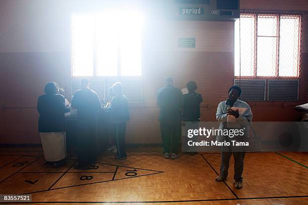 African-Americans line up to vote in a recreation center in the presidential election November 4, 2008 in Birmingham, Alabama. Birmingham, along with...