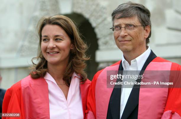 Founder of The Microsoft Corporation Bill Gates with his wife Melinda Gates at the Senate House at Cambridge University, after being made an honorary...