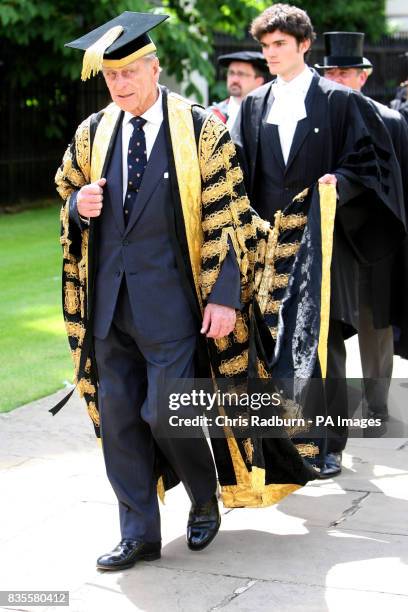 The Duke of Edinburgh, Chancellor of Cambridge University, walks in a procession at the Senate House at Cambridge University, before an honorary...