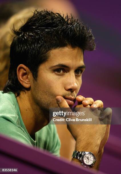 Spanish tennis player Fernando Verdasco watches Ana Ivanovic of Serbia against Jelena Jankovic of Serbia in their first round robin match during the...