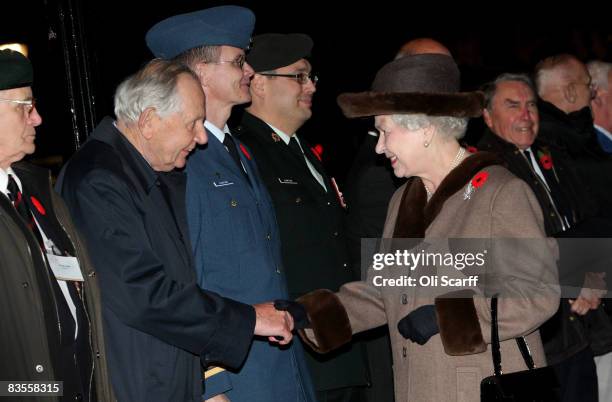 Queen Elizabeth II greets Canadian veterans of World War II and currently serving servicemen as she arrives at Canada House, Trafalgar Square on...