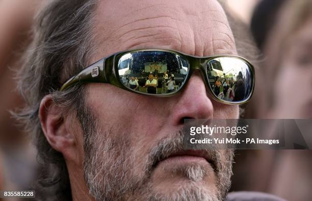 The stage is refelcted in a spectators sunglasses at the Isle of Wight festival, in Newport on the Isle of Wight.