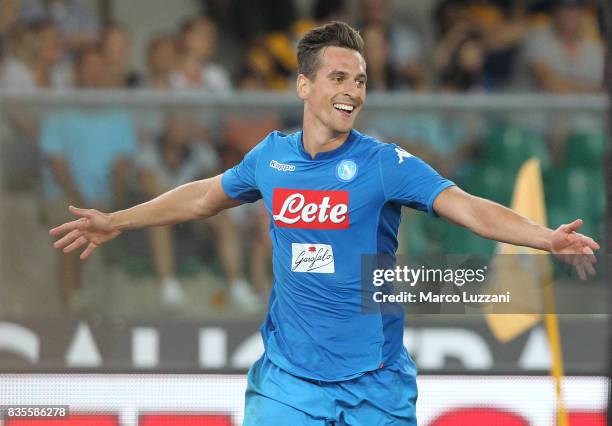 Arkadiusz Milik of SSC Napoli celebrates his goal during the Serie A match between Hellas Verona and SSC Napoli at Stadio Marcantonio Bentegodi on...