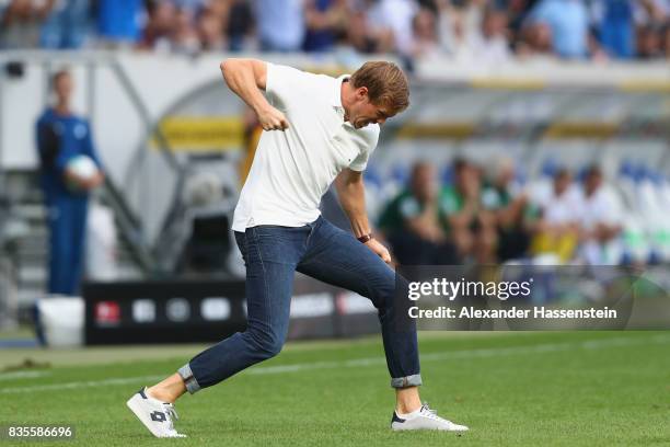 Julian Nagelsmann, head coach of Hoffenheim, celebrates his first team goal during the Bundesliga match between TSG 1899 Hoffenheim and SV Werder...