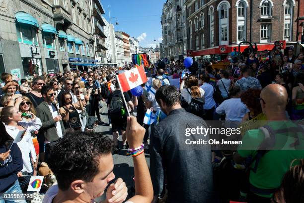 Spectators are seen at the Copenhagen Pride Parade on August 19, 2017 in Copenhagen, Denmark. According to authorities, about 300,000 spectators...