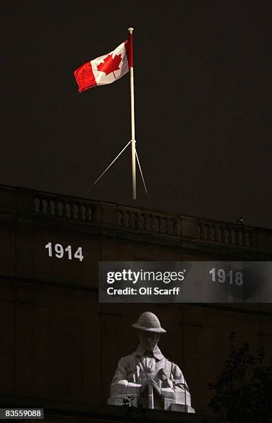 Canadian flag flies above an image of a solider projected on to Canada House in Trafalgar Square during the 'Vigil 1914-1918' ceremony on November 4,...