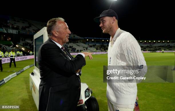 Stuart Broad of England is congratulated by Sir Ian Botham after becoming England's second leading wickettaker during day three of the 1st Investec...