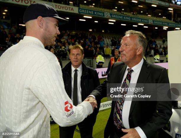 Stuart Broad of England is congratulated by Sir Ian Botham after becoming England's second leading wickettaker during day three of the 1st Investec...