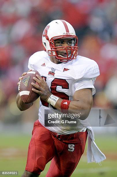 Russell Wilson of the North Carolina State Wolfpack drops back to pass against the Maryland Terrapins on October 25, 2008 at Byrd Stadium in College...