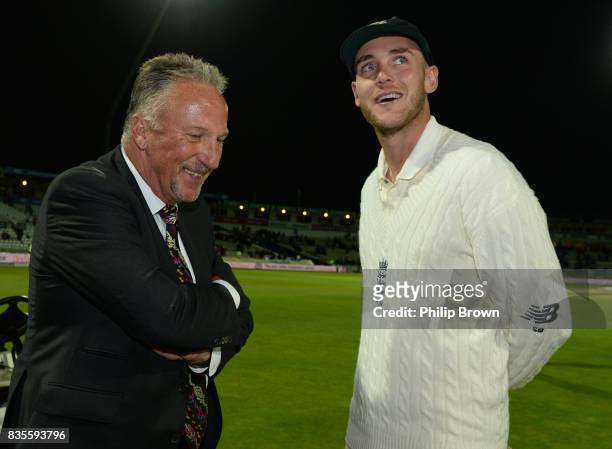 Stuart Broad of England with Sir Ian Botham after England won the 1st Investec Test match between England and the West Indies at Edgbaston cricket...