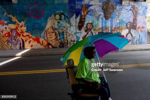 Yogi Stephens heads home after participating in a protest march through the Homewood neighborhood during their Black Brilliance Collective: March and...