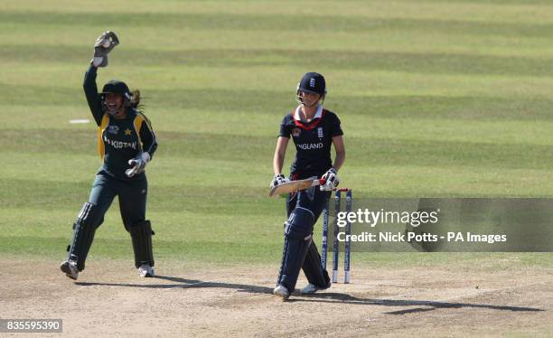 England's Charlotte Edwards shows her dejection after she was caught for 43 by celebrating Pakistan wicketkeeper Syeda Batool Naqvi during the ICC...