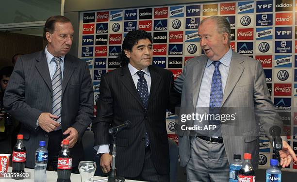 Argentinian football legend Diego Maradona and 1986 World Cup winning coach Carlos Bilardo listen to the president of the Argentinian Football...