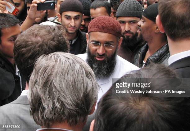 Anjem Choudary, centre facing camera, new leader of the Al Muhajiroun, and Douglas Murray, in grey jacket with back to camera, director of the Centre...