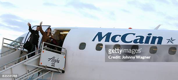 Republican vice-presidential nominee Alaska Gov. Sarah Palin and her husband Todd Palin bid farewell to onlookers at the Ted Stevens International...