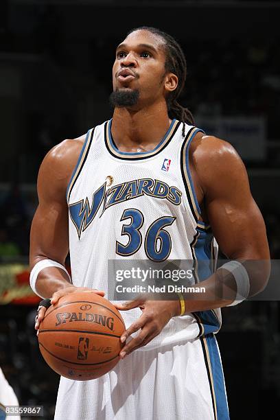 Etan Thomas of the Washington Wizards shoots a free throw during the game against the New Jersey Nets at the Verizon Center on October 29, 2008 in...