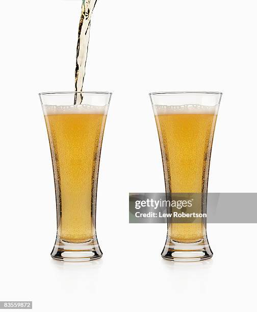 beer and pour on white - beer pour stock pictures, royalty-free photos & images