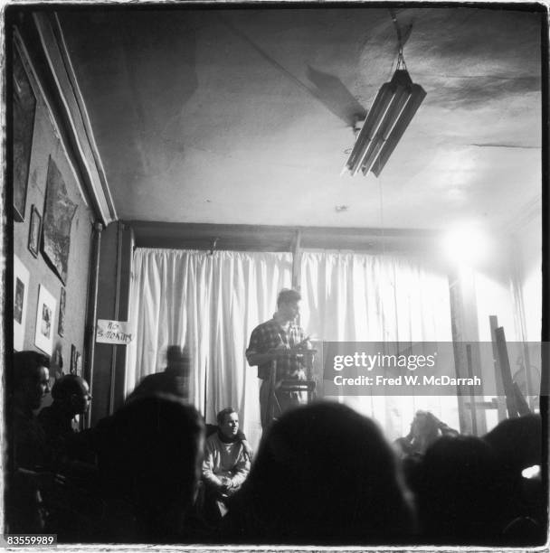American author Jack Kerouac reads poetry from a podium at the Artist's Studio , New York, New York, February 15, 1959.