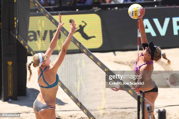 Summer and April Ross jump at the net during their round 4 match at the AVP Manhattan Beach Open - Day 3 on August 19, 2017 in Manhattan Beach,...