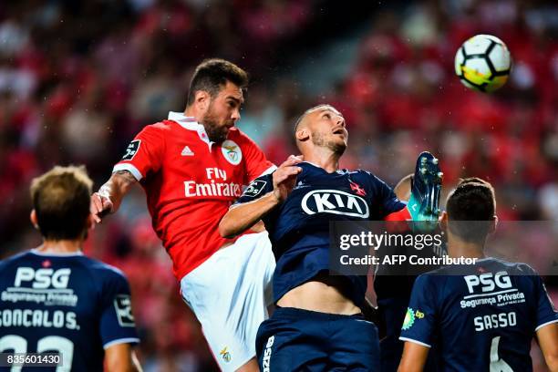 Benfica's Brazilian defender Jardel Vieira vies with Belenenses' French midfielder Hassan Yebda during the Portuguese League football match SL...