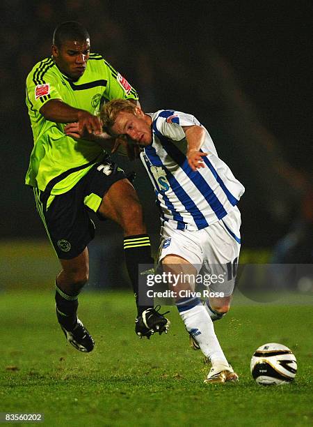 Kevin Thornton of Brighton and Hove Albion is challenged by Miles Addison of Derby during the Carling Cup Third Round match between Brighton and Hove...