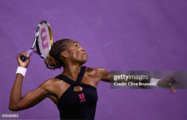 Venus Williams of the USA serves against Dinara Safina of Russia in their first round robin match during the Sony Ericsson Championships at the...