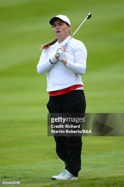 Lily May Humphreys of England hits an approach shot during her semi-final match against Paula Kimer of Germany during the Girls' British Open Amateur...