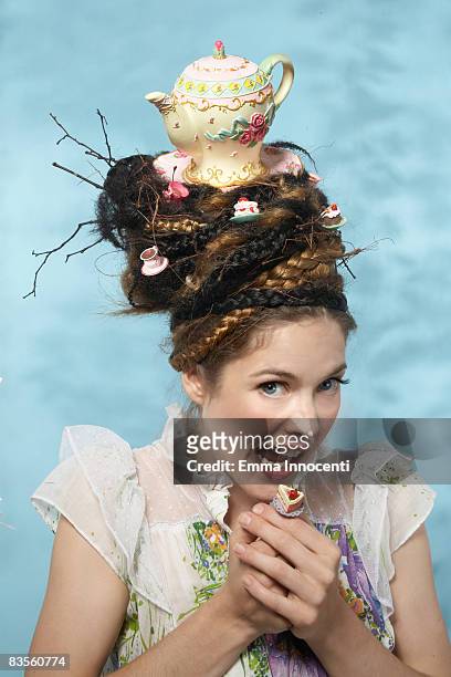 portrait of a woman with a teapot on her head - cake face imagens e fotografias de stock