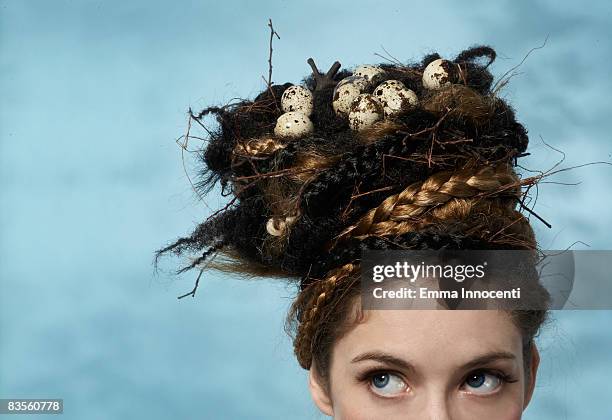 woman with a nest on her head - animal nest ストックフォトと画像