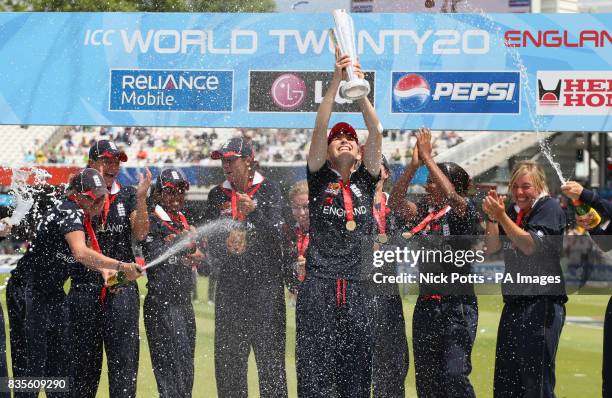 England players celebrate as England captain Charlotte Edwards lifts the ICC World Twenty20 Trophy after the Final of the Womens ICC World Twenty20...