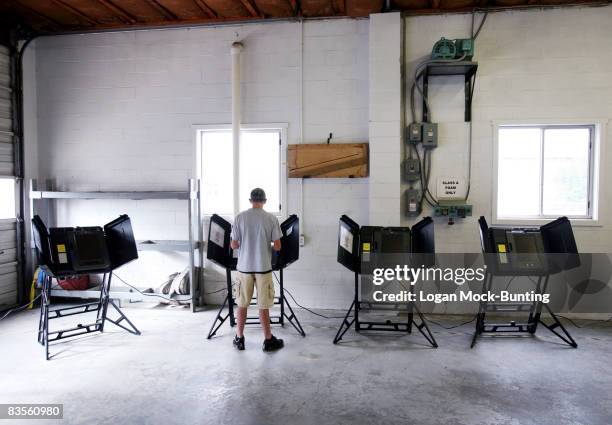 Kenny Powell, Jr casts his first ballot at a volunteer fire station serving as a polling station on November 4, 2008 in Shallotte, North Carolina....