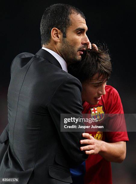 Barcelona's coach Josep Guardiola embraces Bojan Krkic after substituting him during the UEFA Champions League Group C match between Barcelona and...