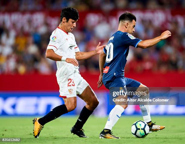 Jose Manuel Jurado of RCD Espanyol being followed by Borja Lasso of Sevilla FC during the La Liga match between Sevilla and Espanyol at Estadio Ramon...