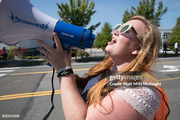 Demonstrator chants into a bull horn outside of Google's offices during an anti-Trump protest on August 19, 2017 in Kirkland, Washington. The...