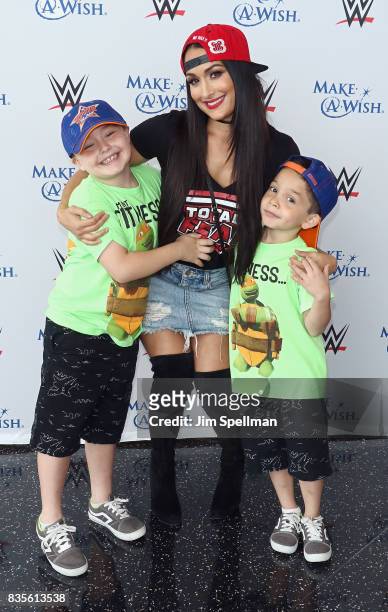 Nikki Bella poses with wish kids at the WWE Superstars Surprise Make-A-Wish Families at One World Observatory on August 19, 2017 in New York City.