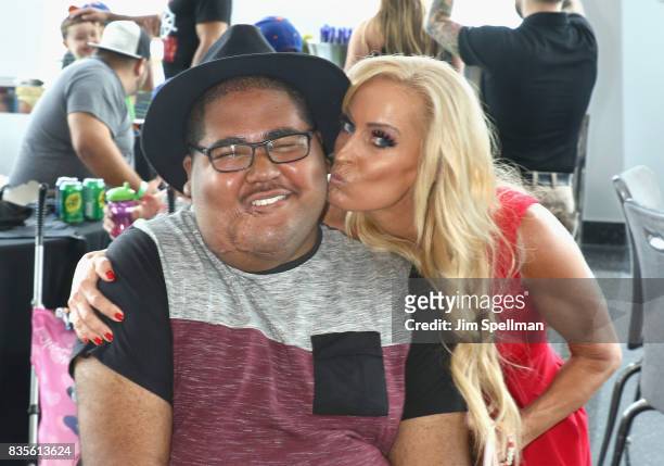 Dana Warrior poses with a wish kid at the WWE Superstars Surprise Make-A-Wish Families at One World Observatory on August 19, 2017 in New York City.