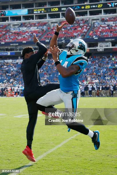 Joe Webb and Cam Newton of the Carolina Panthers celebrate after a touchdown in the third quarter of a preseason game against the Tennessee Titans at...